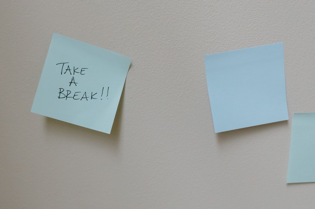 services-03 Blue sticky notes on a wall with handwritten motivational message 'Take a Break'.